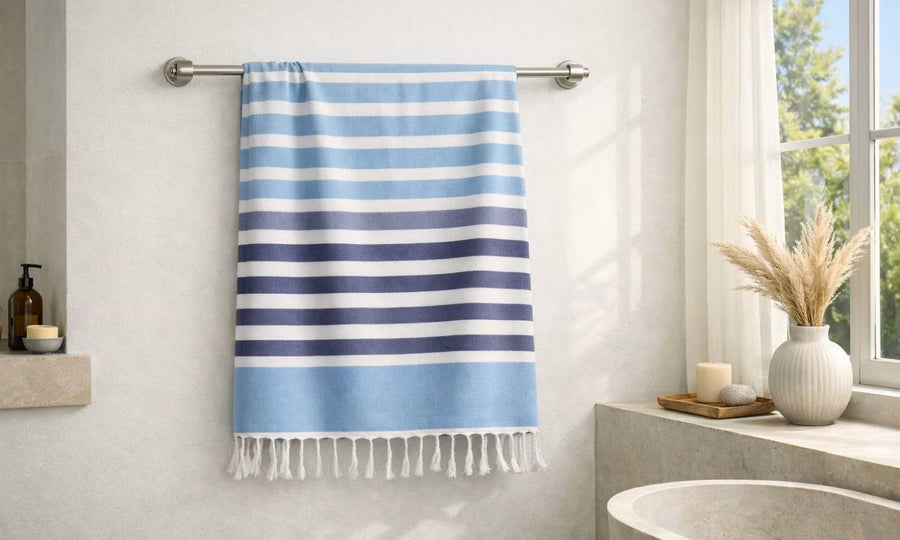 Soft cotton bath towel for men hanging in a minimal modern Indian bathroom, quick-dry and absorbent for humid weather