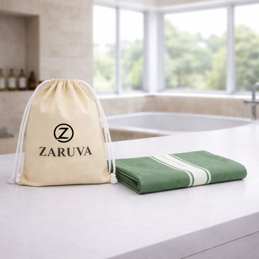 zv-pack=set-of-1 | Zaruva 100% bamboo fibre bath towel in Rainforest Sage Green, folded on countertop with Zaruva pouch, 75x150 cm (30x60 in)