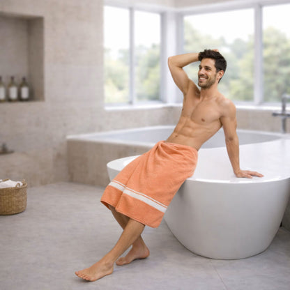 Lifestyle photo: model wrapped in Zaruva orange bamboo cotton bath towel, 75x150 cm, modern bathroom